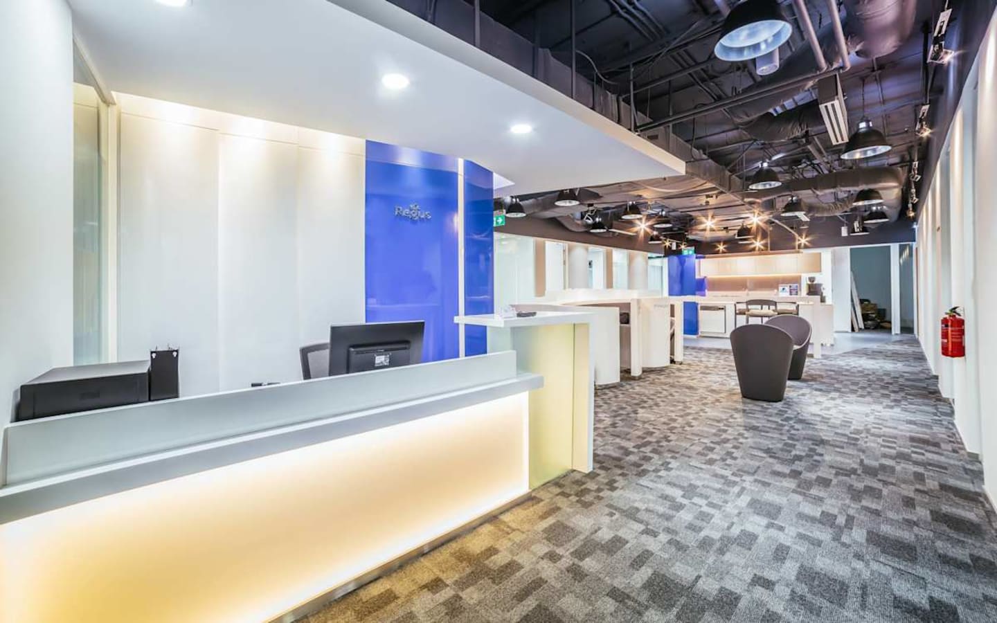 Modern coworking space in Changi Business Park with sleek design and ample natural light.