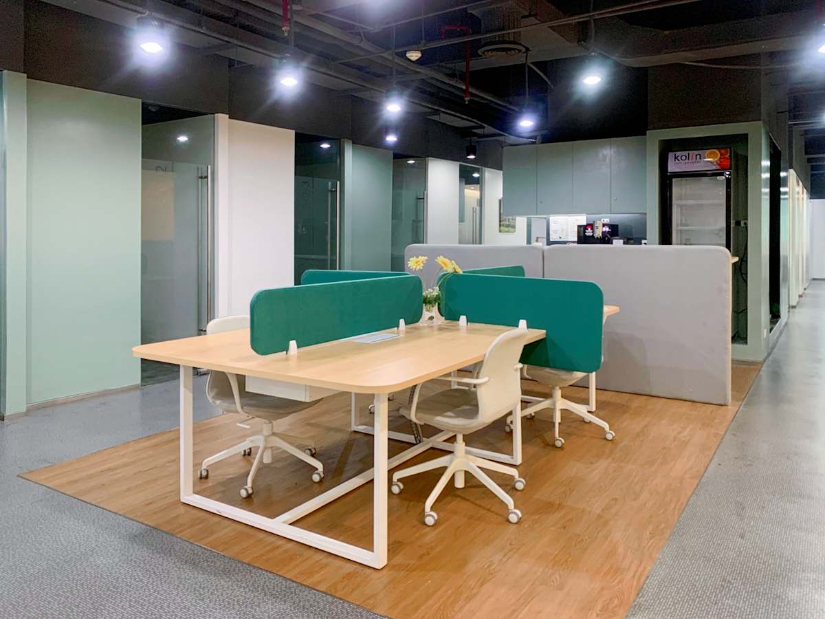 Modern coworking space with comfortable seating and bright lighting on Filinvest Avenue.