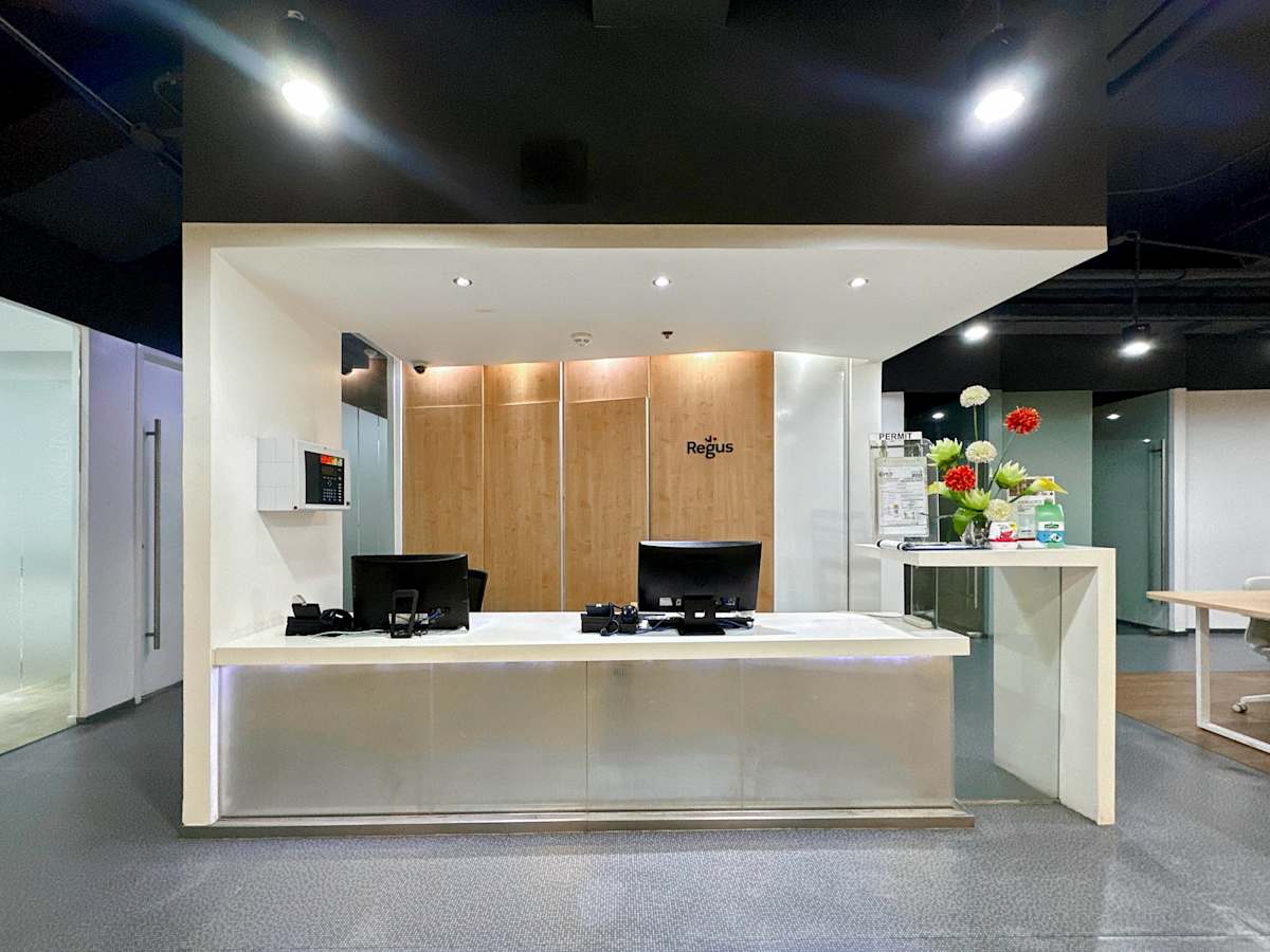 Modern reception area with sleek lighting and wood accents, perfect for welcoming clients.