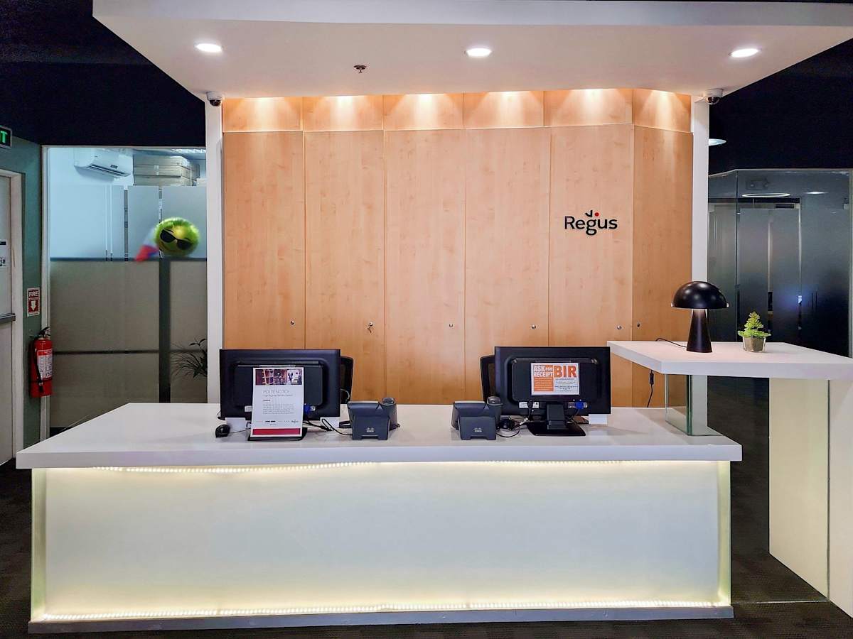 Modern coworking reception with sleek design and warm wood accents in Central Luzon.