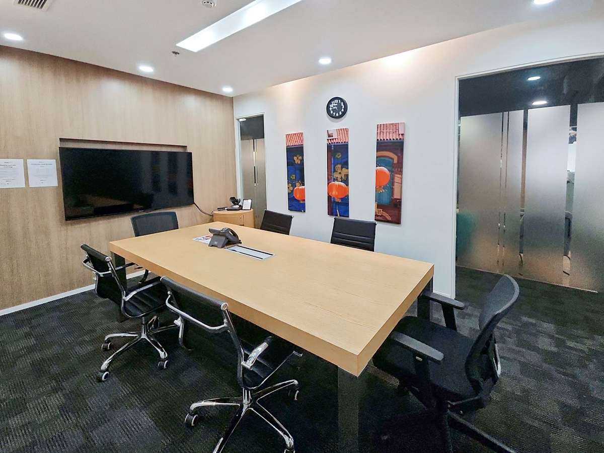 Modern conference room with sleek furnishings, ample lighting, and a vibrant decor.