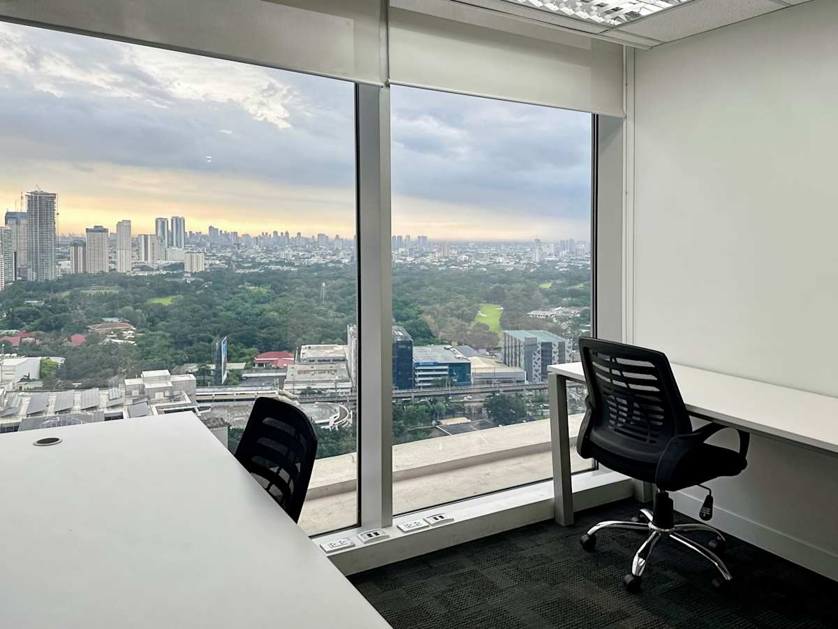 Bright office with a stunning city view, sleek furniture, and ample natural light. Perfect for productivity.