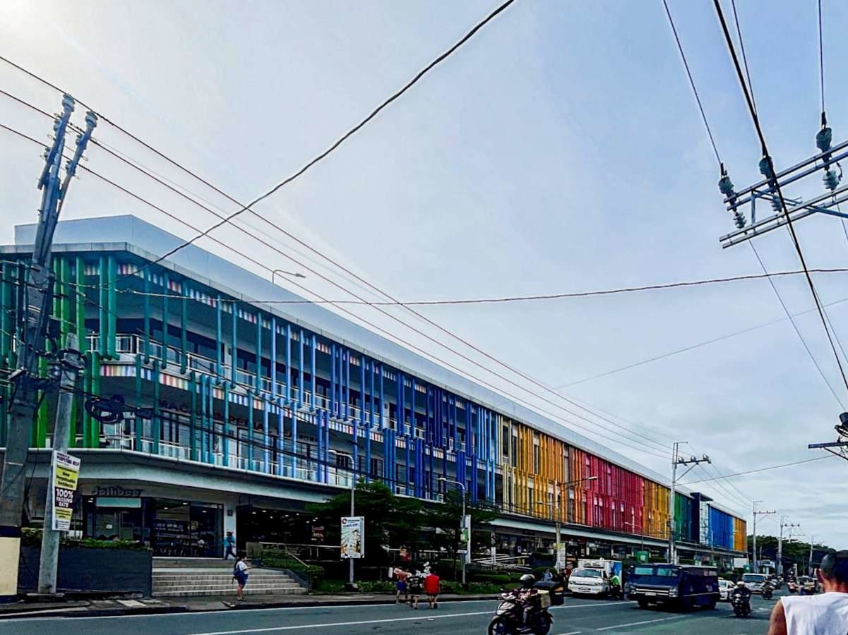 Vibrant, modern office complex with colorful exterior, offering dynamic workspace opportunities.