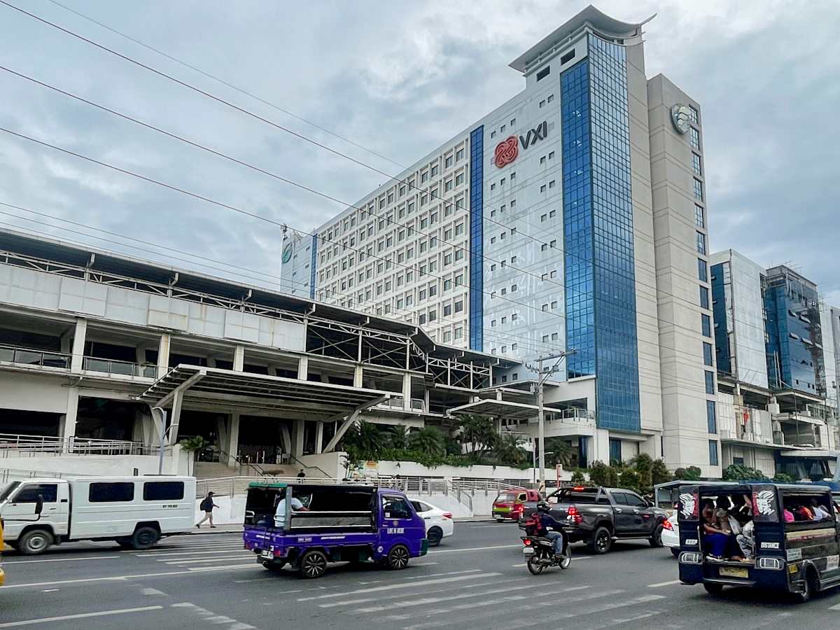 Modern office building with easy access to transportation and vibrant urban surroundings.