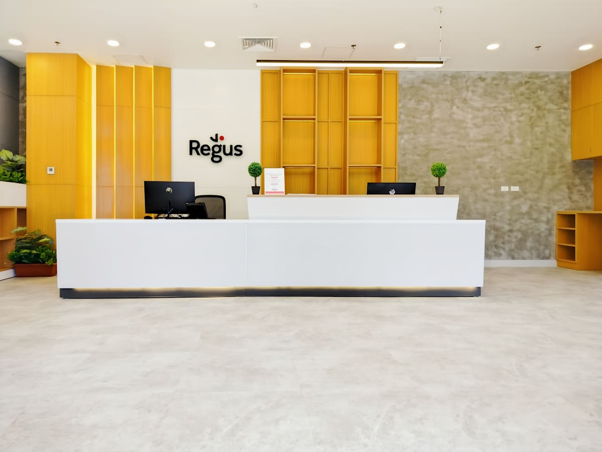 Modern office reception with sleek white desk and inviting neutral tones. Ideal for professionals.