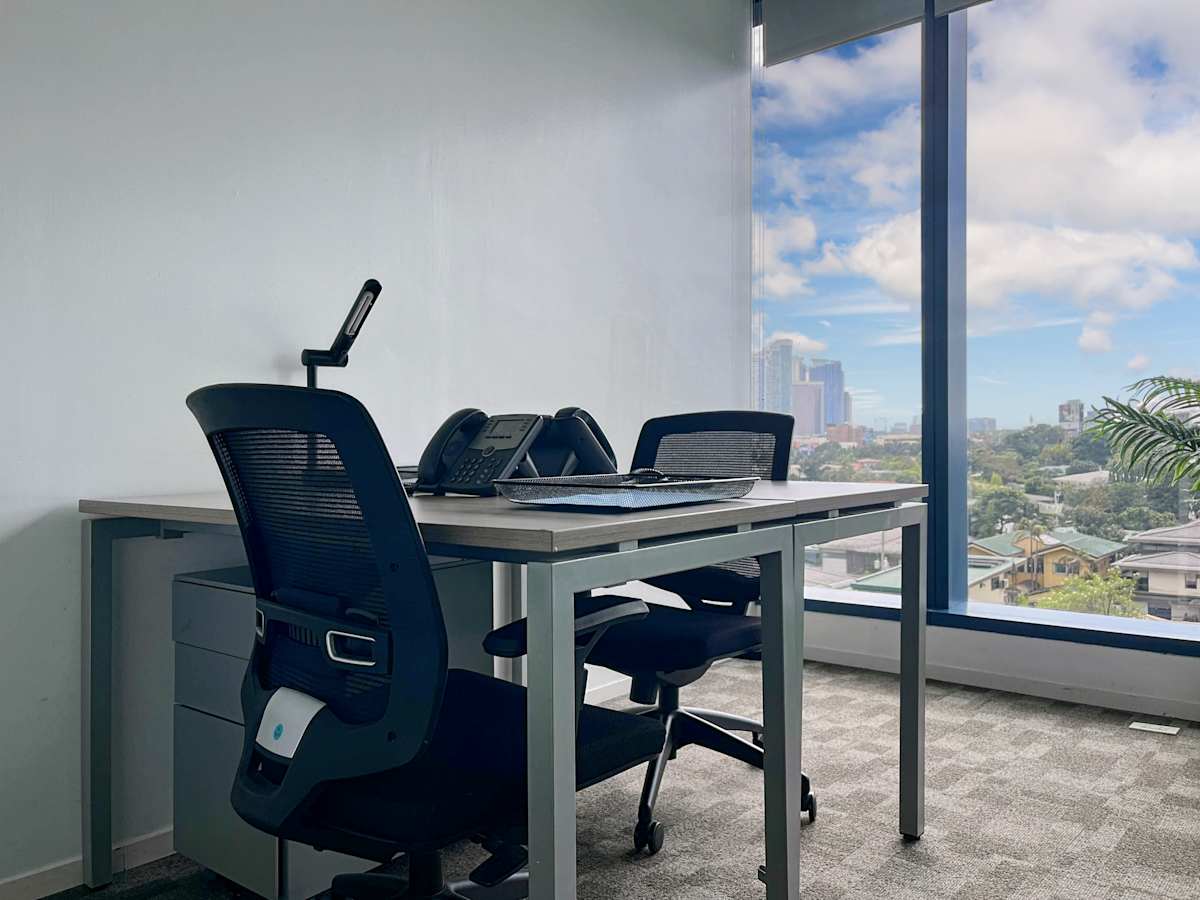 Modern coworking space in Estrella with ergonomic chairs and views of Metro Manila.