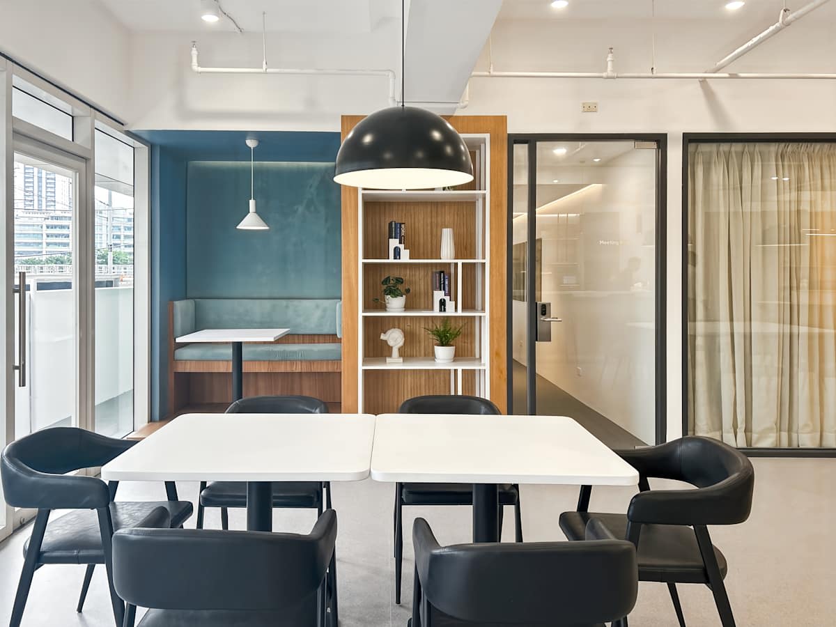 Modern coworking space with sleek furniture and ample natural light in Metro Manila.