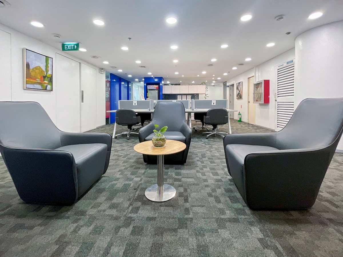 Modern coworking space with sleek seating, collaborative tables, and ambient lighting.