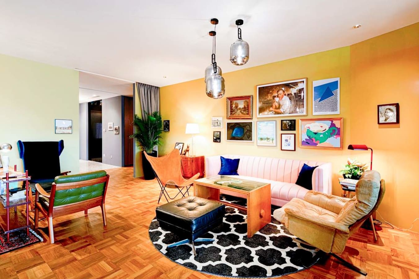 Stylish coworking space with eclectic décor, comfortable seating, and vibrant artwork.