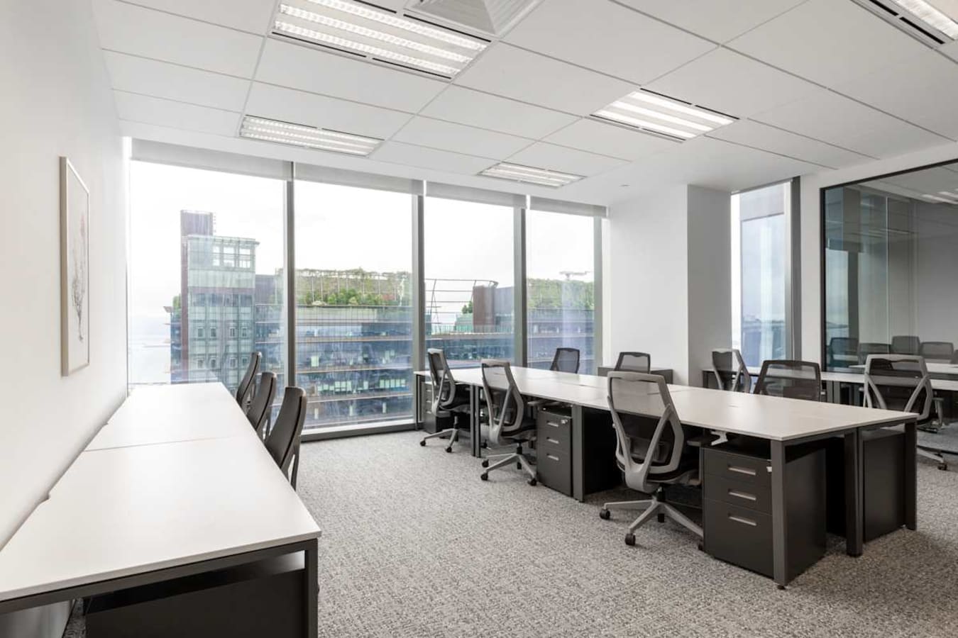 Modern coworking space with natural light and city views in Marina View, Singapore.