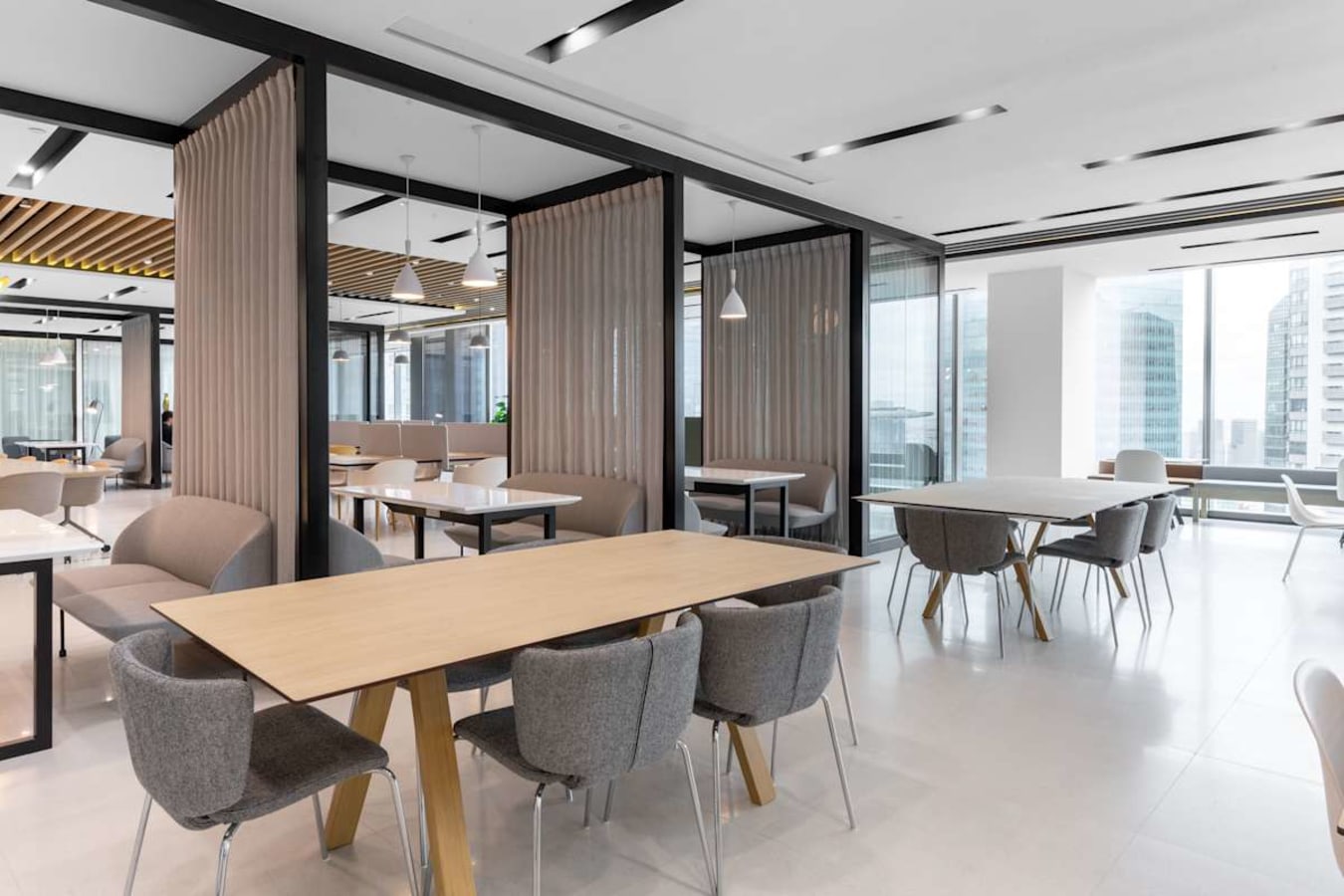 Modern coworking space with sleek design, ample natural light, and flexible seating in Marina View.