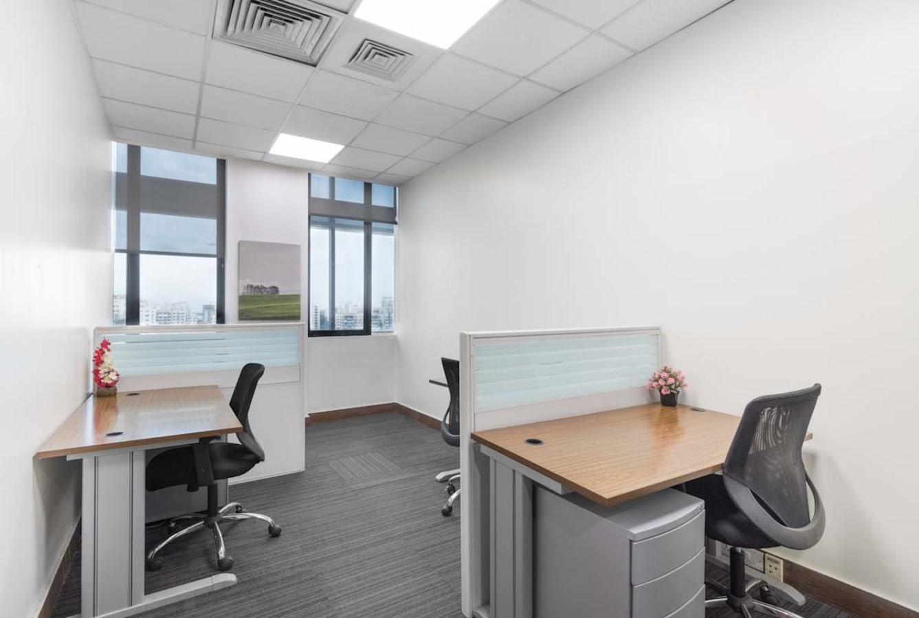 Bright, modern coworking space with private desks, ergonomic chairs, and city views in Pune.