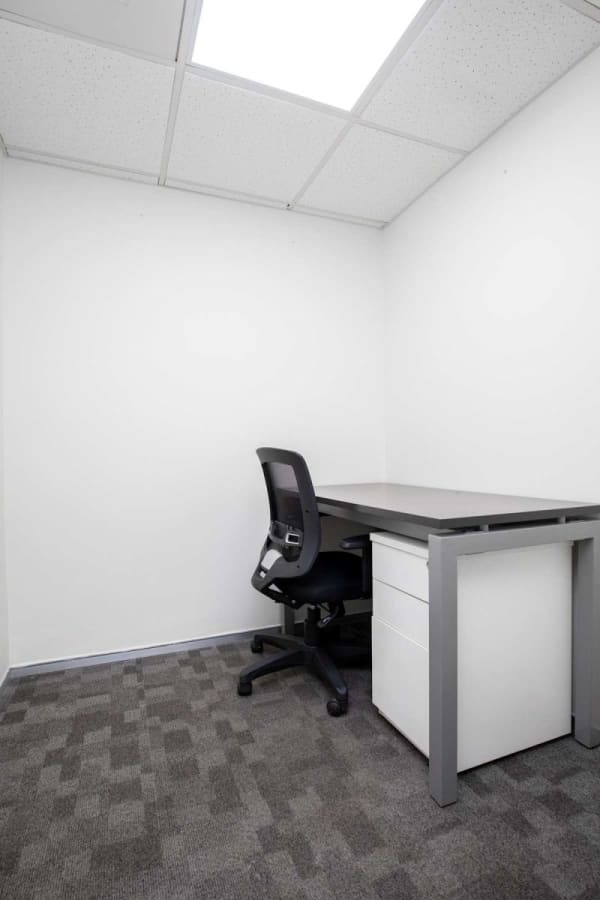 Modern private office with ergonomic chair and ample desk space in Madhya Pradesh coworking hub.