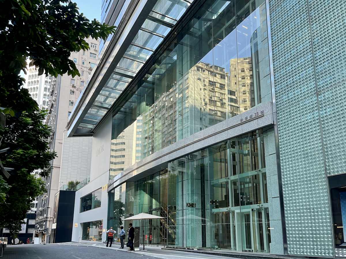 Modern coworking space on Hysan Avenue, featuring sleek glass exteriors and urban views.