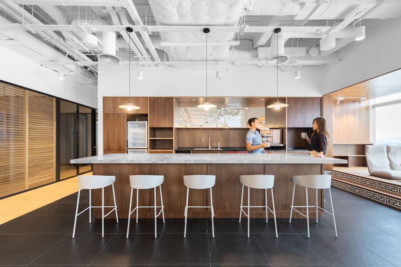 Sleek coworking space on Hennessy Road featuring a modern kitchen and ample seating.