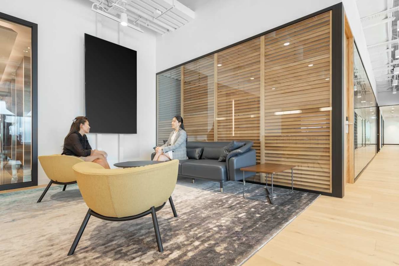 Modern coworking space on Hennessy Road featuring cozy seating and ample natural light.