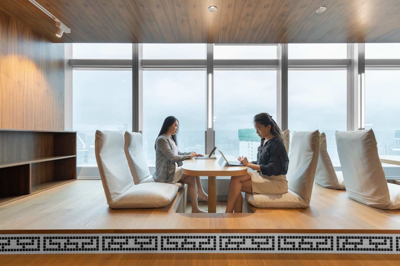 Bright coworking space on Hennessy Road with cozy seating and city views. Ideal for collaboration.