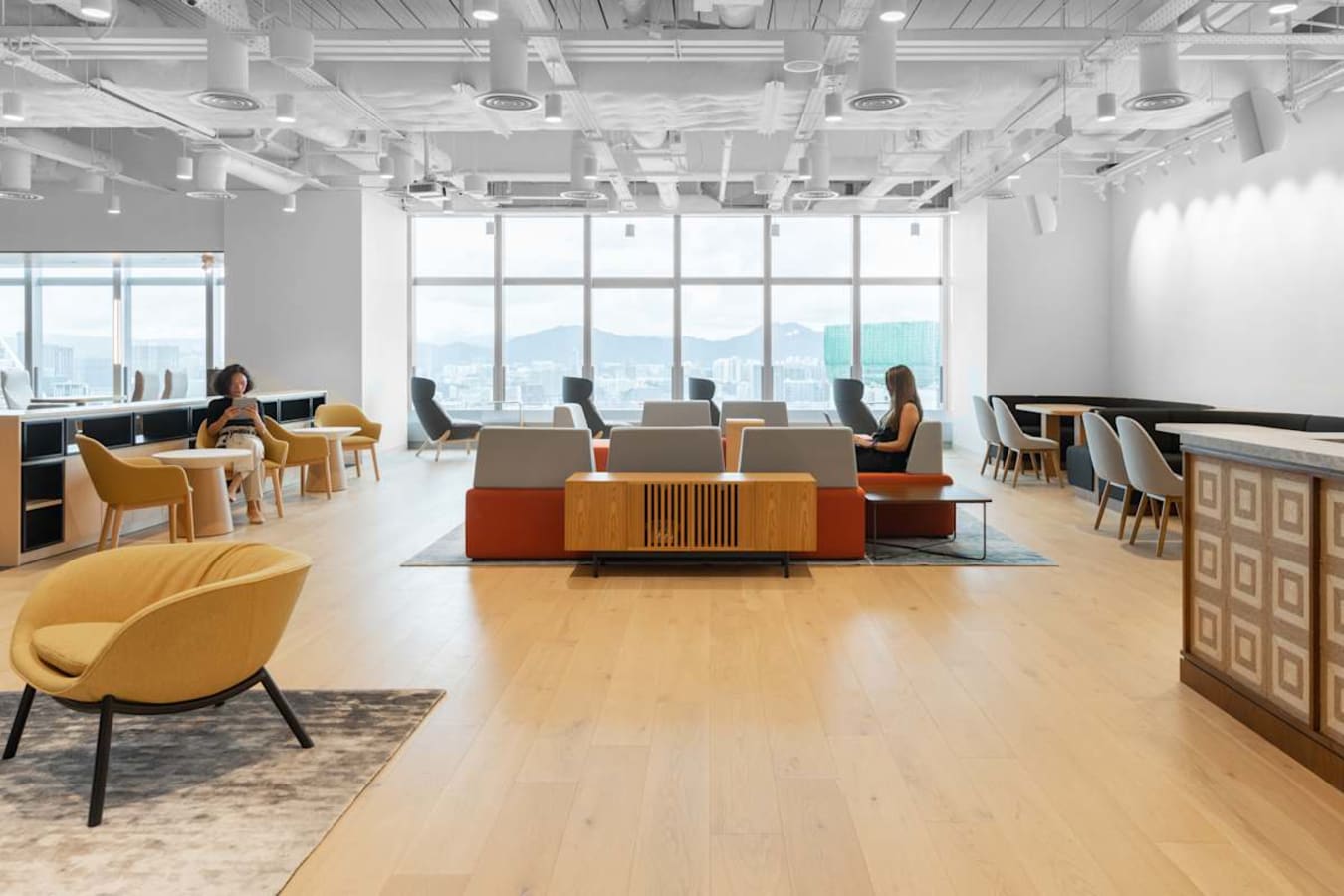Bright coworking space on Hennessy Road with modern seating and expansive city views.