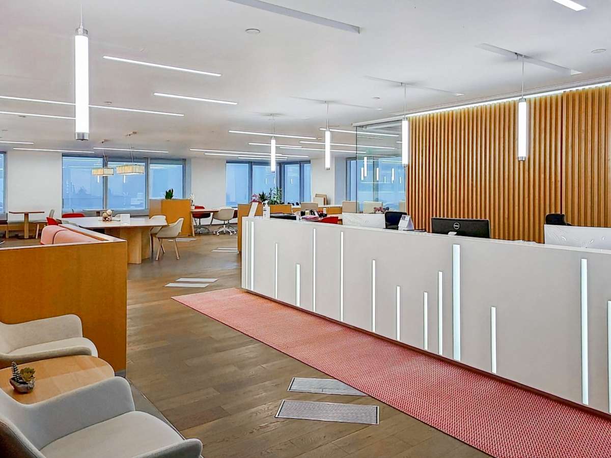 Modern coworking space in Queen's Road Central with open seating and stylish design.