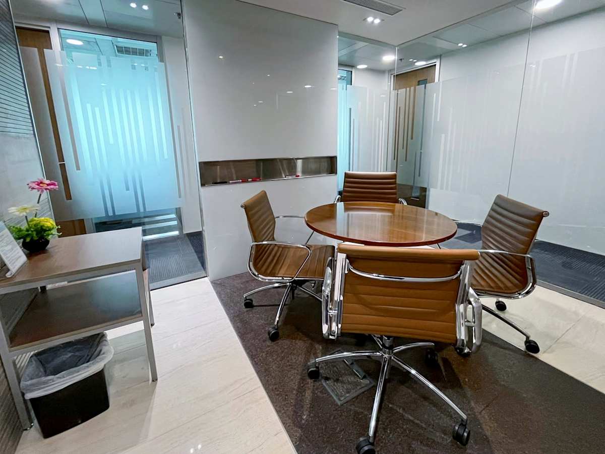 Sleek meeting area with modern seating in a Queen's Road Central coworking space.