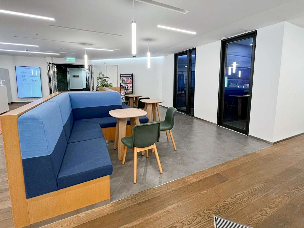 Modern coworking space with cozy seating and natural light on Queen's Road Central.