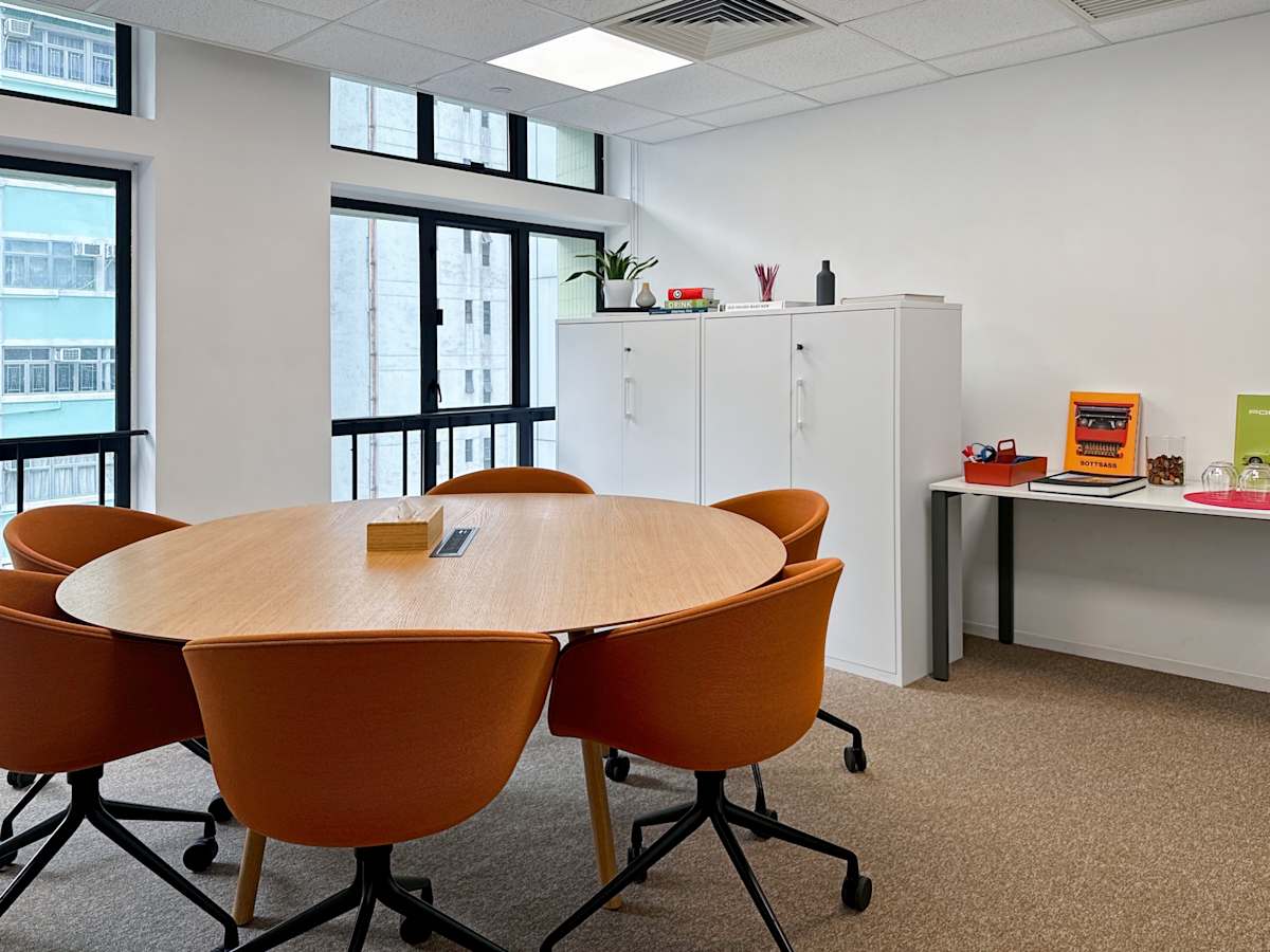 Bright, modern coworking space with large windows and comfortable seating on Hennessy Road.