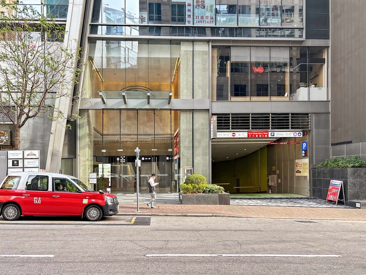 Modern coworking space entrance on Observatory Road, featuring sleek glass facade and easy access.