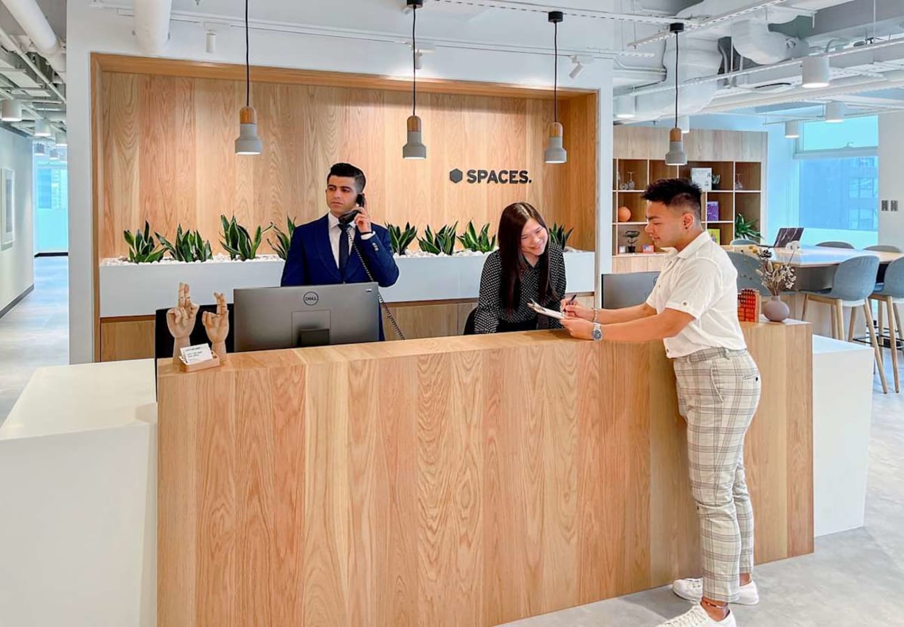 Welcoming reception area with modern design and natural wood accents. Ideal for coworking.