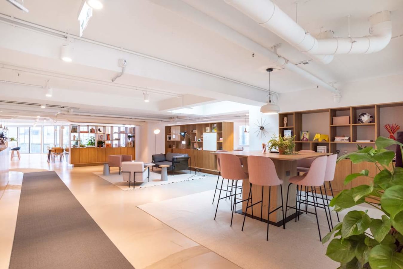 Modern coworking space with open layout and stylish seating on Wai Yip Street.