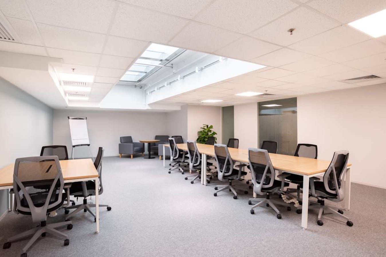 Modern coworking space with ample seating and natural light on Wai Yip Street.