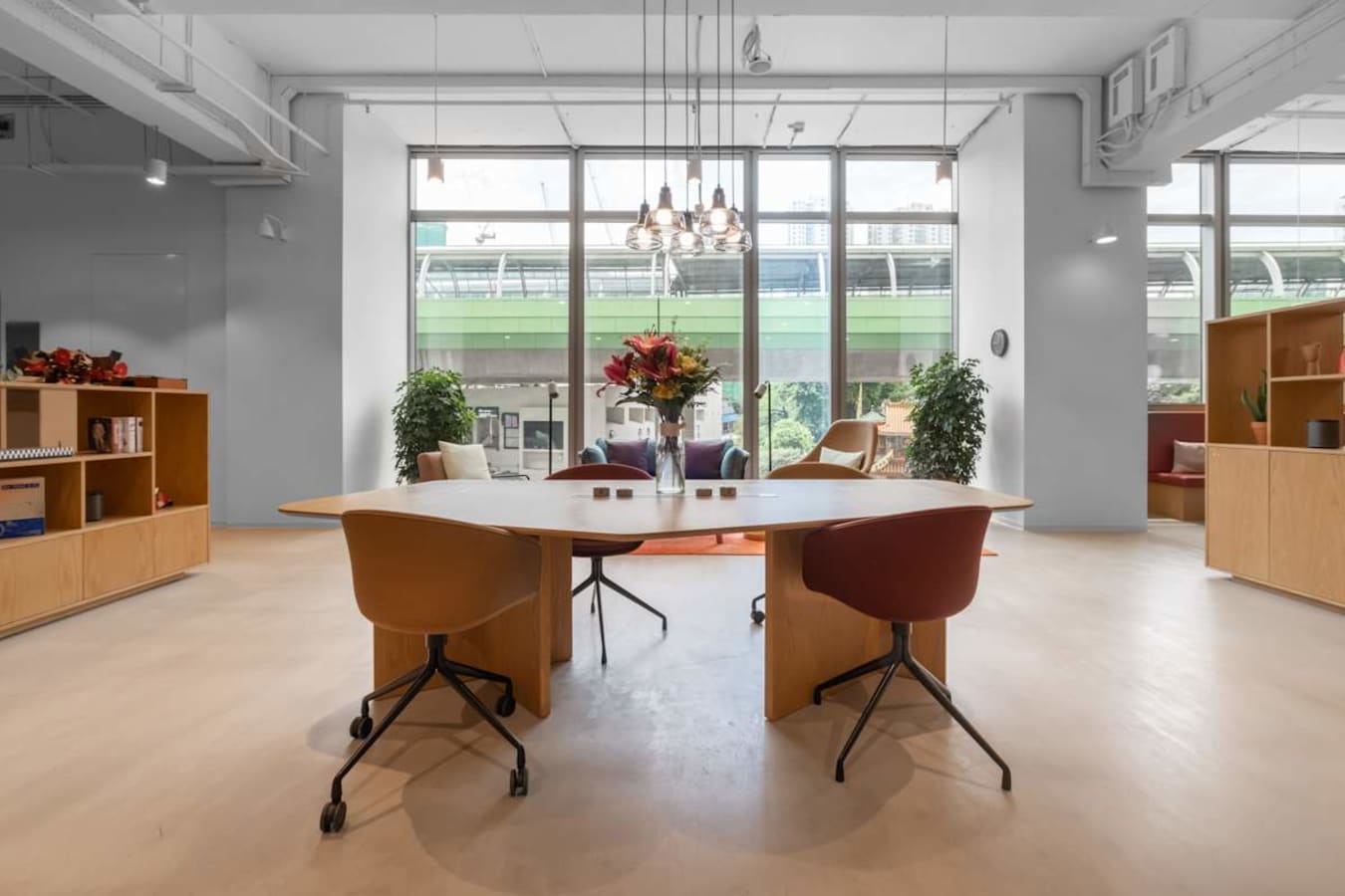 Bright coworking space with modern furniture and large windows on Wong Chuk Hang Road.
