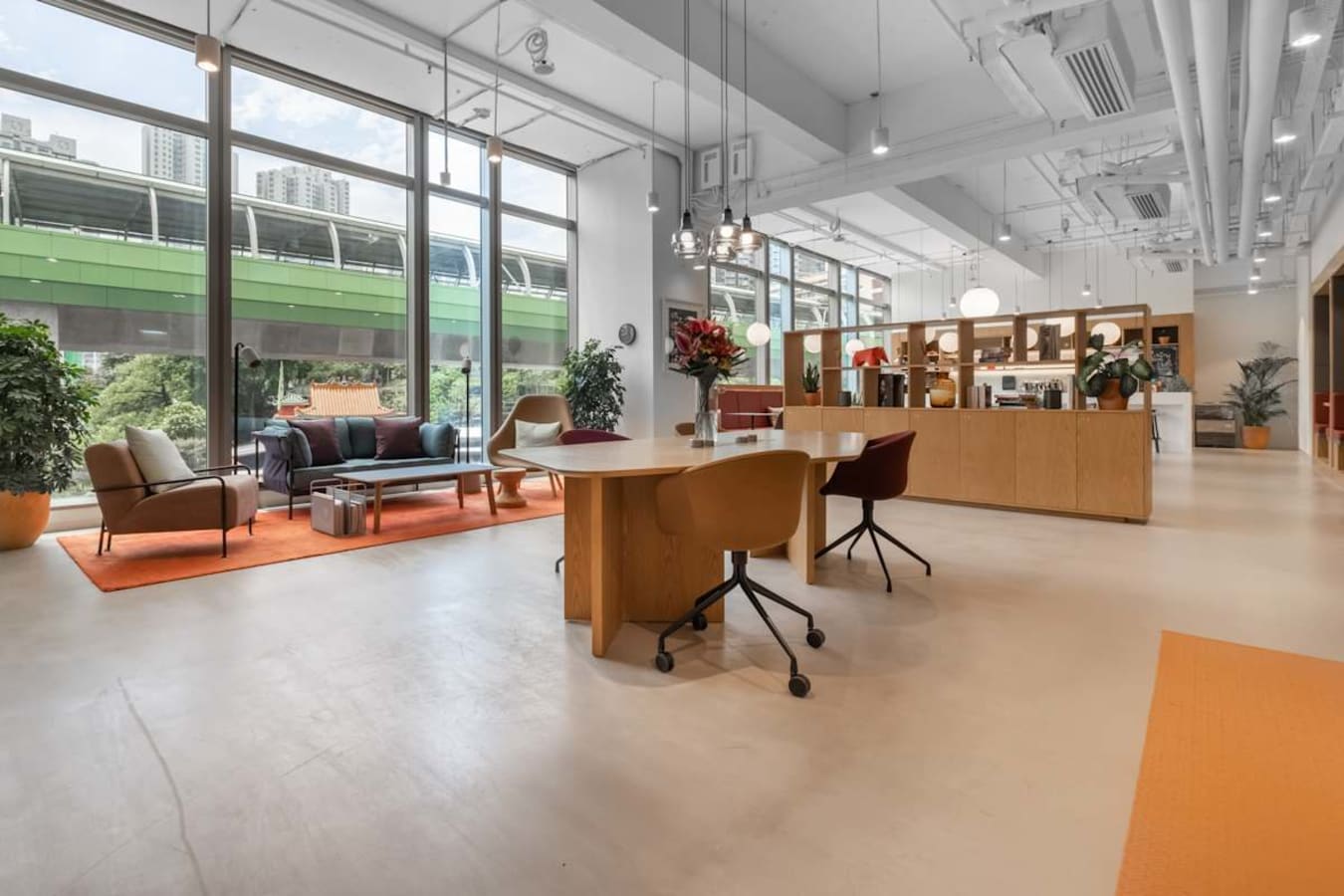 Modern coworking space with open layout, natural light, and stylish furnishings on Wong Chuk Hang Road.
