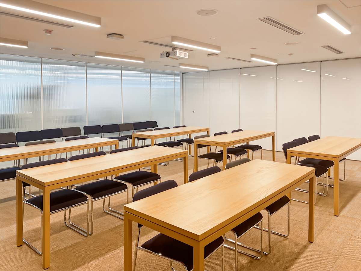 Bright, modern coworking space with flexible seating and sleek conference setup. Ideal for meetings.