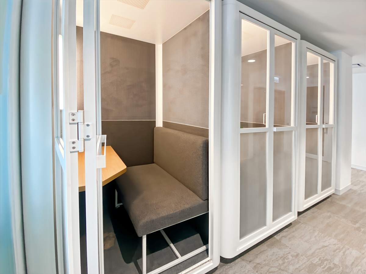 Private phone booth for focused work in Canton Road coworking space.