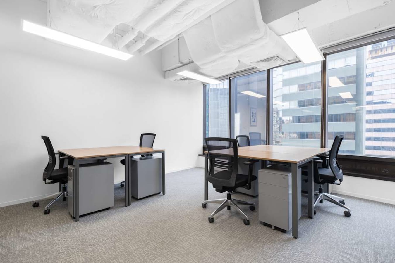 Bright coworking space on Nathan Road with modern desks and ergonomic chairs.