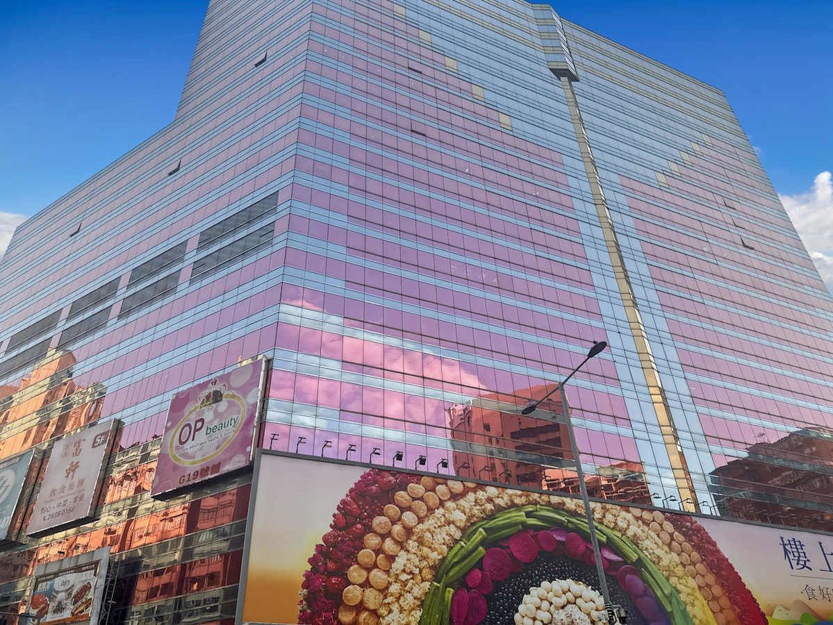 Modern flexible workspace at Nathan Road, featuring vibrant, reflective exterior.