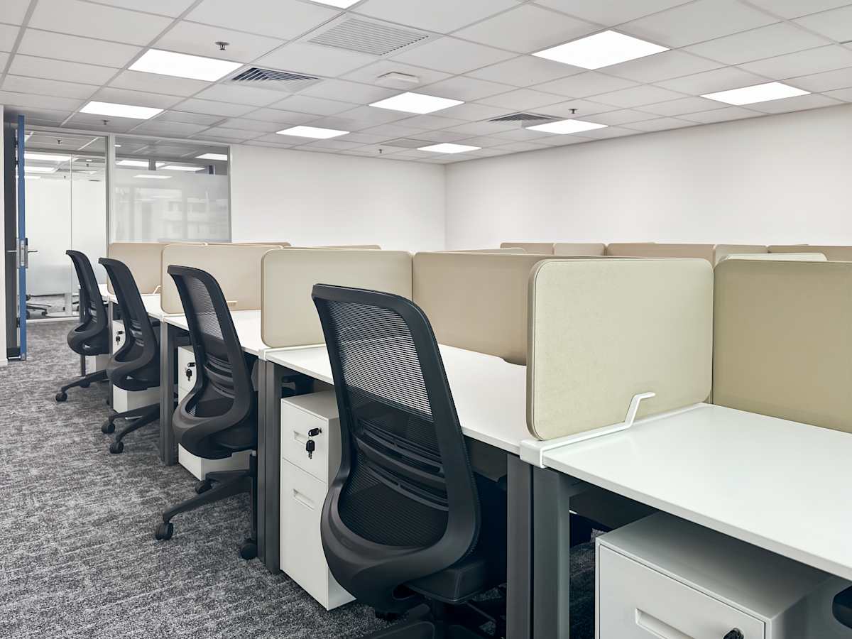 Modern coworking space with ergonomic chairs and private workstations on Nathan Road.