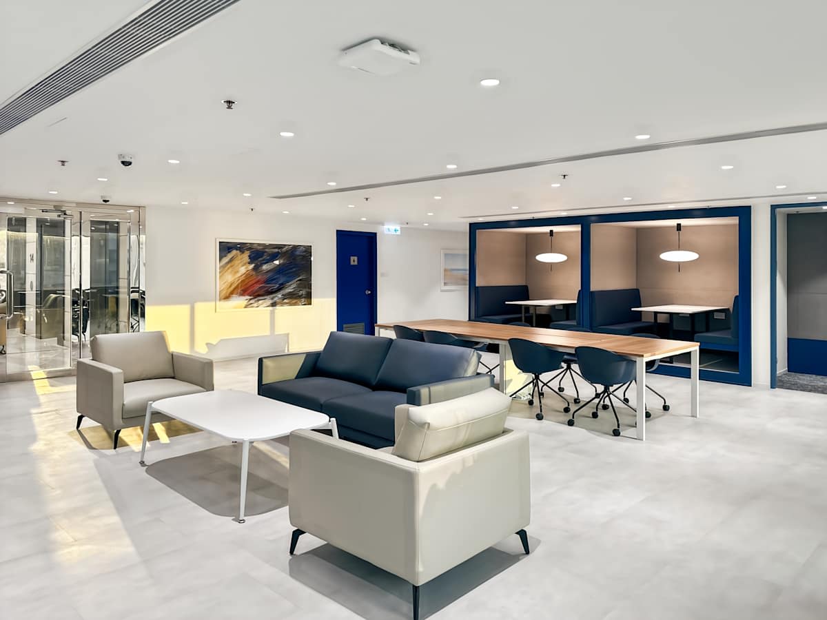 Modern coworking space with sleek seating, collaborative desks, and ample lighting on Nathan Road.
