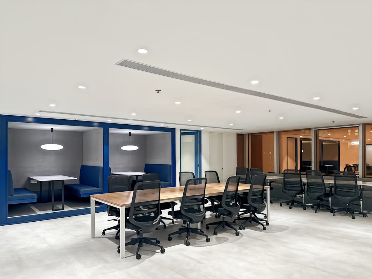 Modern coworking space with open seating and private booths on Nathan Road. Ideal for collaboration.