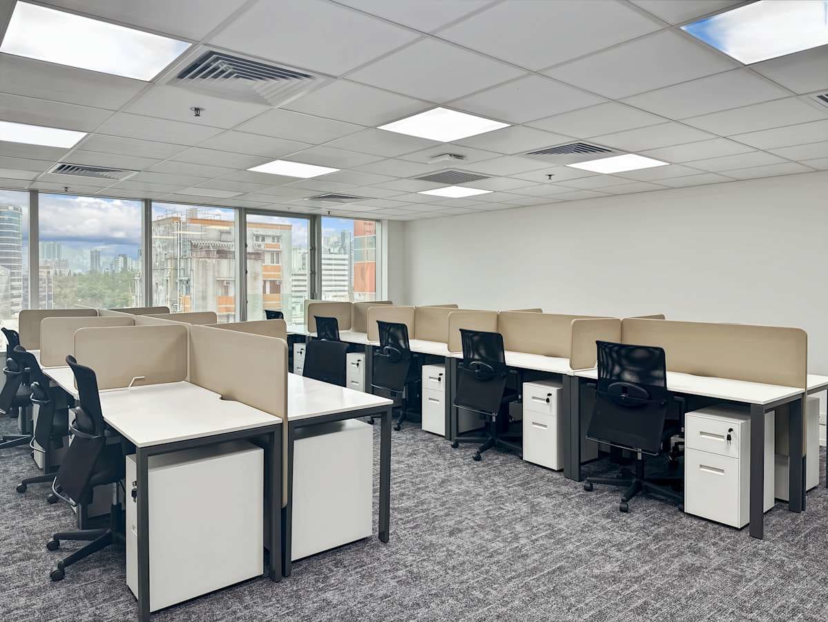 Modern coworking space with ergonomic chairs and ample natural light on Nathan Road.