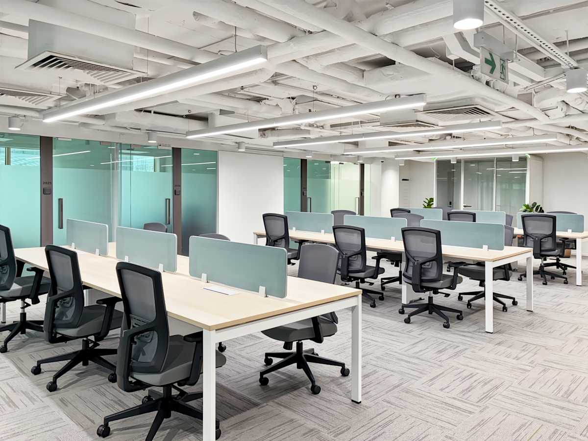 Modern coworking space on Canton Road with open desks, sleek design, and abundant natural light.