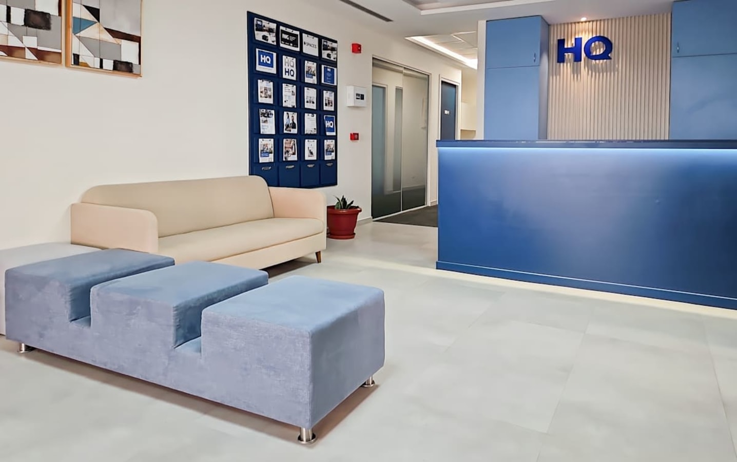 Modern coworking space with stylish seating and a welcoming reception area.