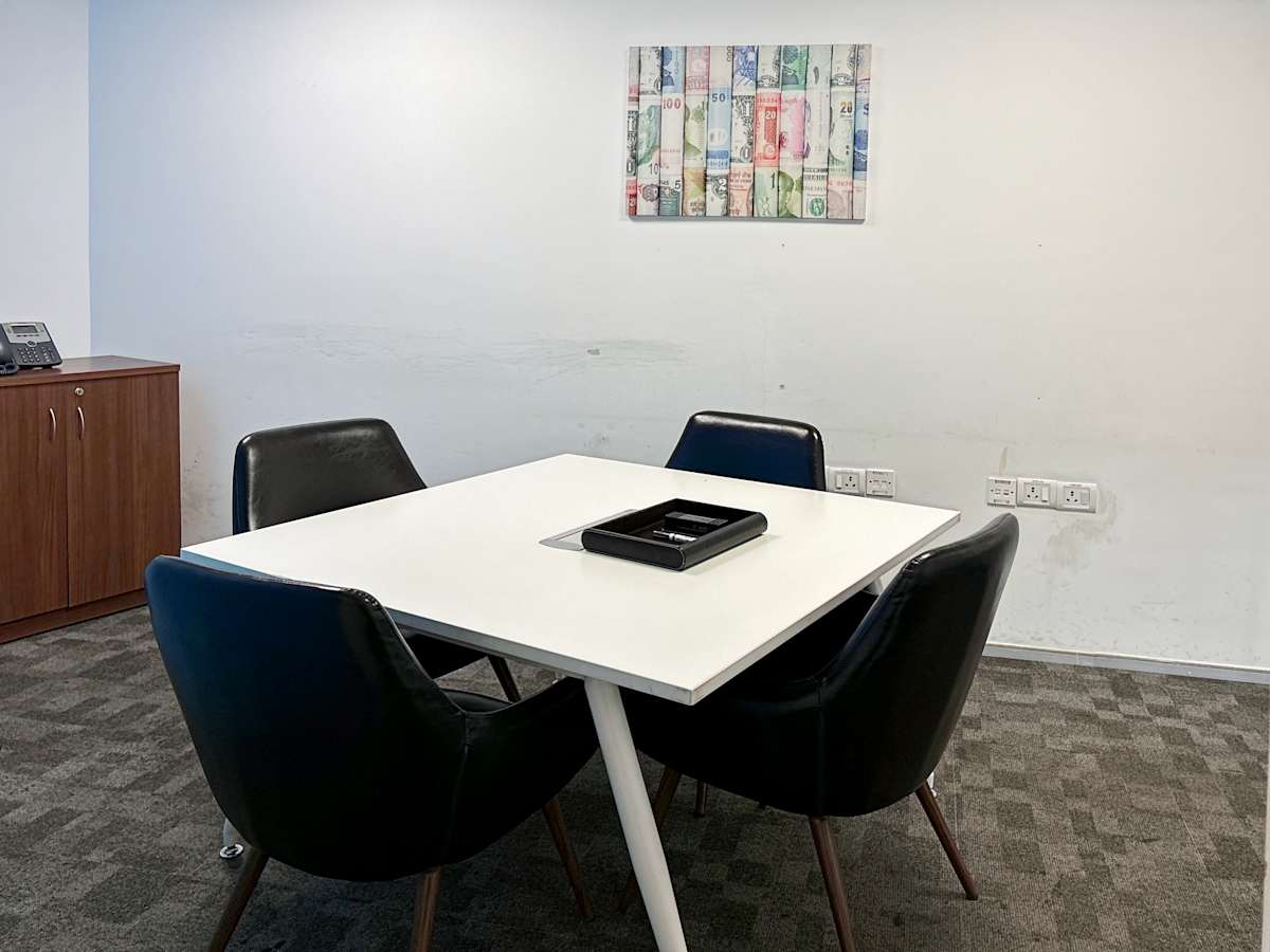 Modern coworking space with sleek furnishings and a minimalist aesthetic. Perfect for collaboration.
