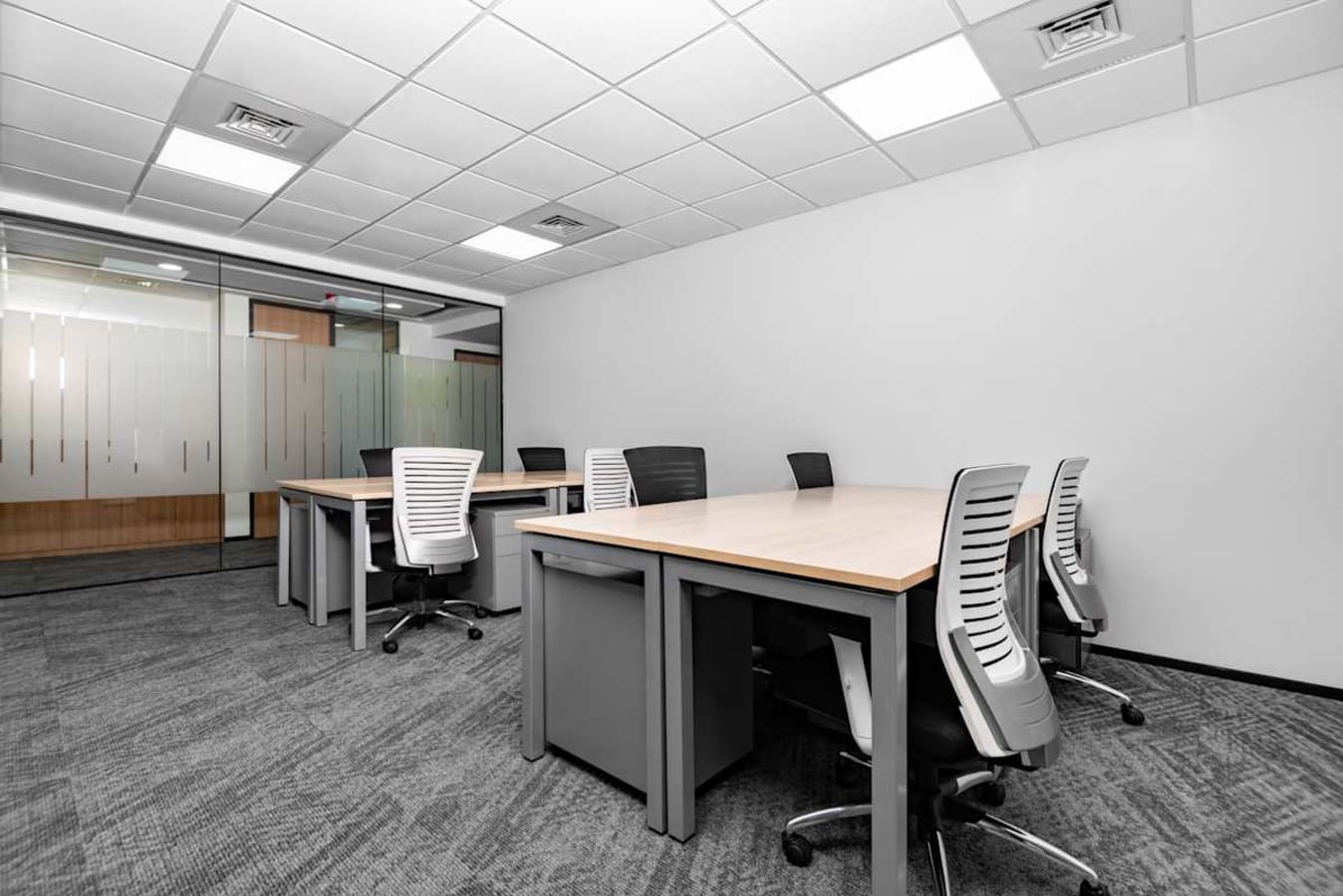 Modern coworking space with spacious desks, ergonomic chairs, and ample natural light in Bandra Kurla.