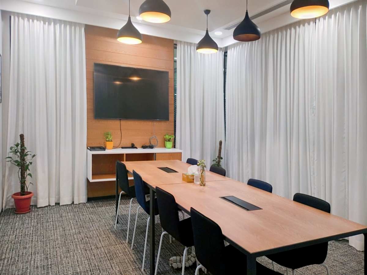 Modern conference room with natural light, sleek design, and state-of-the-art amenities.
