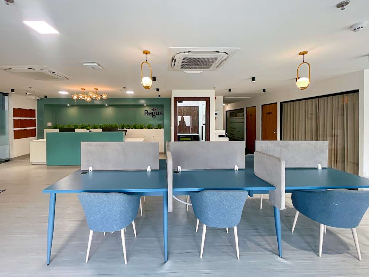Modern coworking space with stylish seating and ambient lighting in Sahastradhara Road.