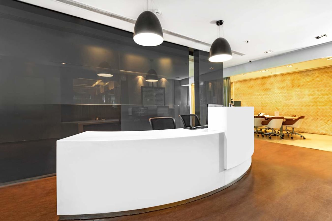 Modern coworking space with sleek reception and meeting room in Karnataka.
