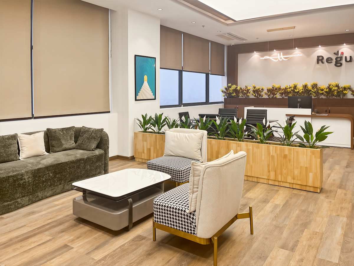 Modern coworking space with natural light, cozy seating, and stylish decor in Haryana.