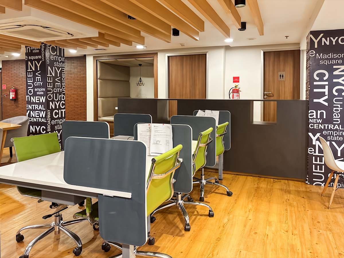 Modern coworking space with vibrant chairs and collaborative desks in Sector 17A, Chandigarh.