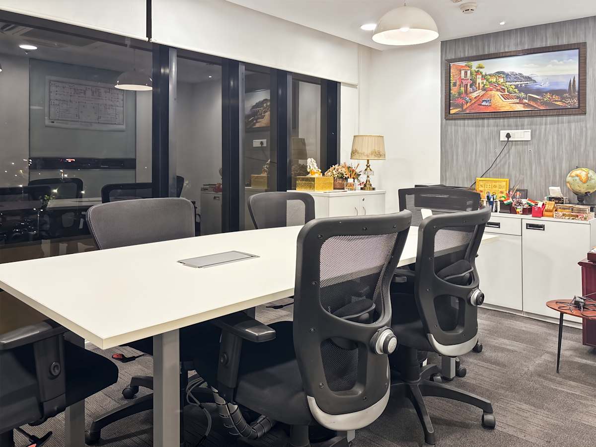 Modern coworking space with ergonomic chairs, ample lighting, and a scenic view in Chandigarh.